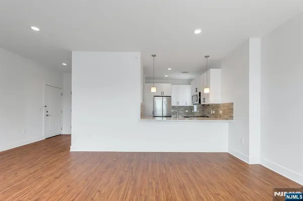 a view of kitchen with wooden floor