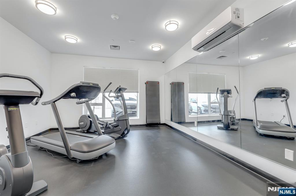 85 Ridge Road, Unit 406 North Arlington, NJ 07031 - Photo 20 of 27 a room with lots of gym equipment