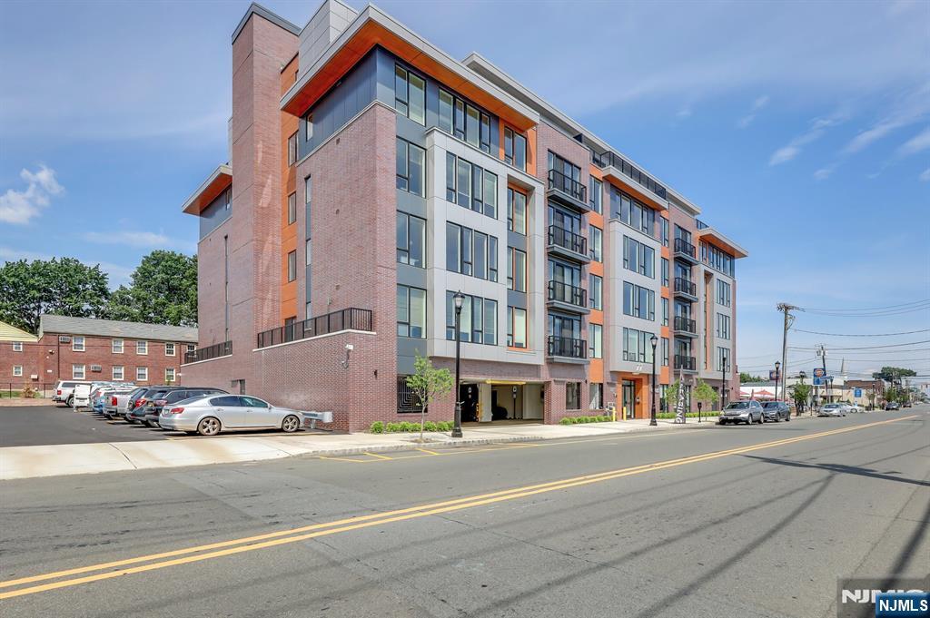 85 Ridge Road, Unit 406 North Arlington, NJ 07031 - Photo 2 of 27 a tall building sitting on the side of a street