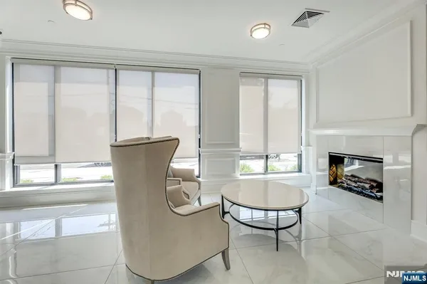 a view of a livingroom with furniture and a fireplace