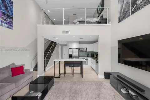 a bathroom with a sink toilet and a mirror