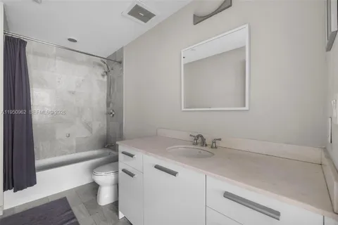 a view of a patio with couches table and chairs with potted plants