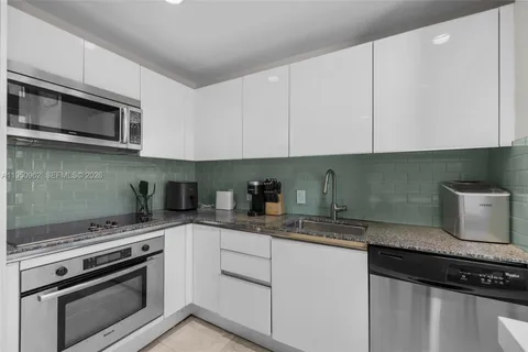 a room with table chairs and entryway