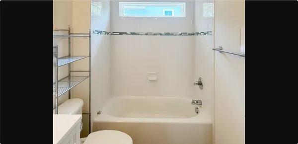a bathroom with a shower and a toilet