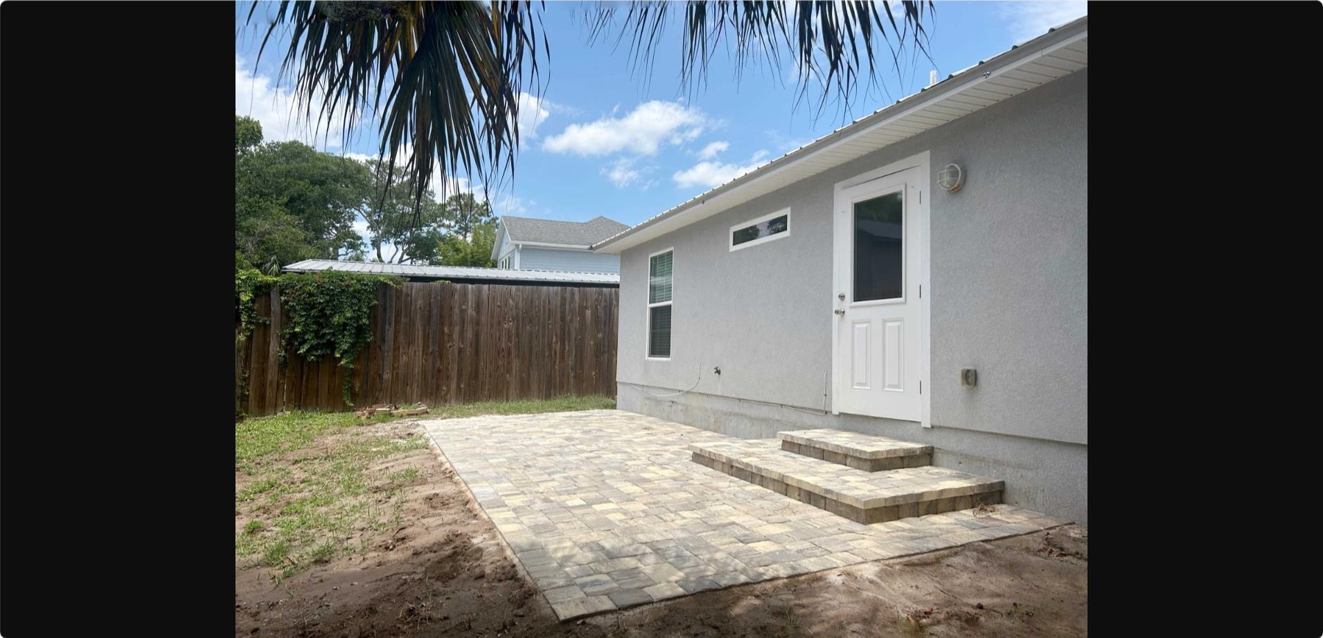 209 7th Street St. Augustine, FL 32080 - Photo 22 of 28 a front view of a house with a yard