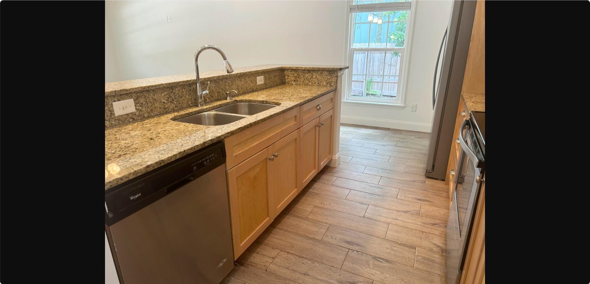 209 7th Street St. Augustine, FL 32080 - Photo 5 of 28 a kitchen with sink a faucet and stove