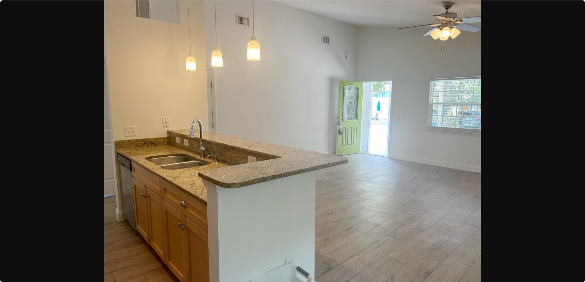 209 7th Street St. Augustine, FL 32080 - Photo 6 of 28 a kitchen that has a sink and a stove