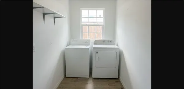 a utility room with dryer and washer