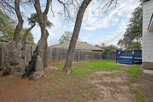a backyard of a house with lots of green space