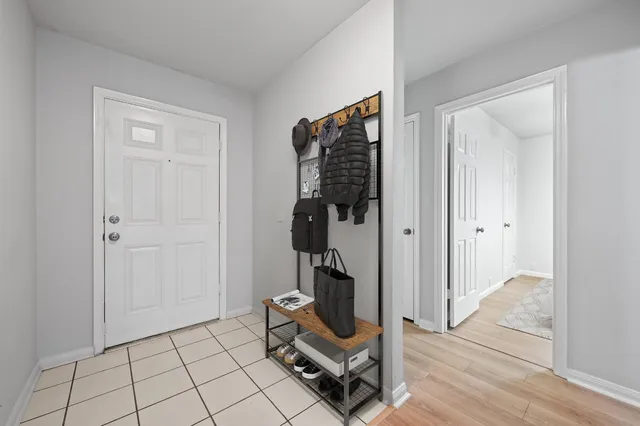 a view of an empty room and wooden floor