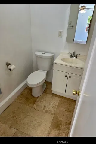 a bathroom with a toilet and a sink