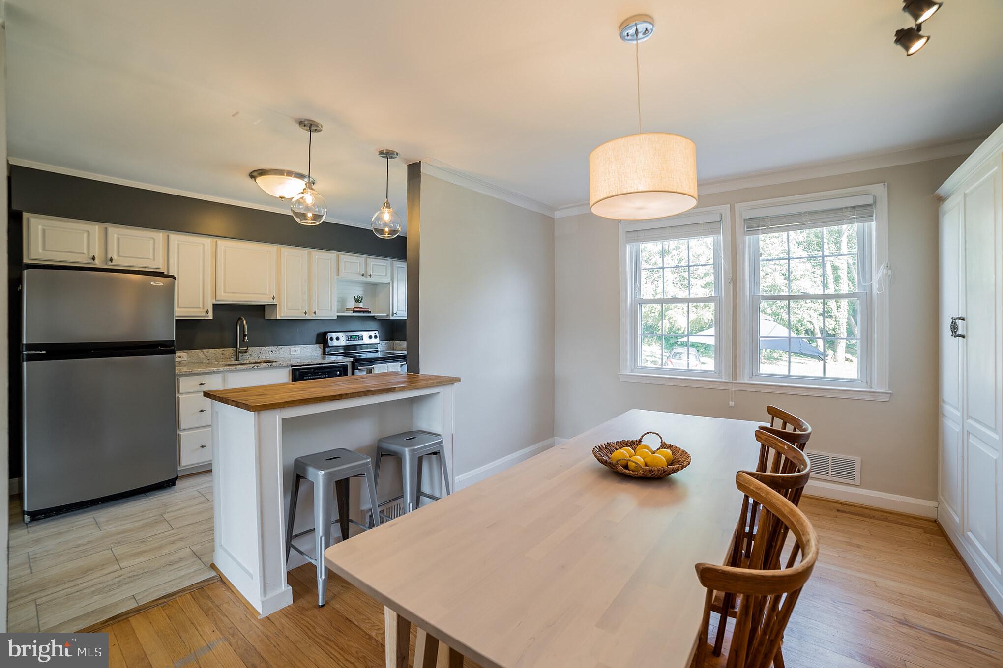 403 Lambeth Road Baltimore, MD 21228 - Photo 7 of 30 Open kitchen with breakfast bar to dining room
