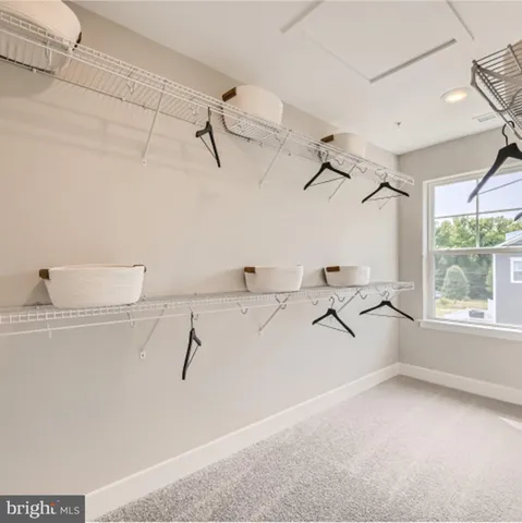 a view of a kitchen with a sink and windows