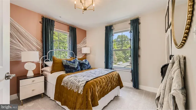 a bed room with a bed and a window