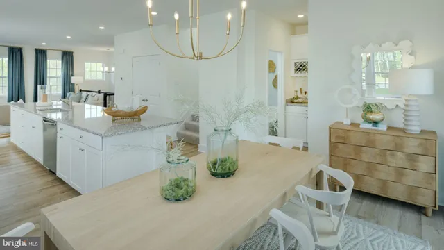 a bathroom with a double vanity sink a mirror and bathtub