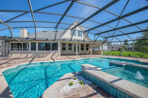 a view of a swimming pool with a patio