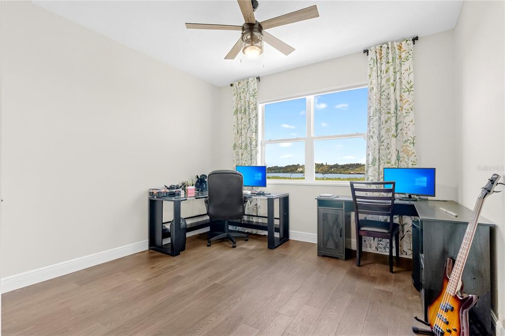 9009 Palm Key Avenue Oldsmar, FL 34677 - Photo 11 of 38 a view of a workspace with furniture and a window