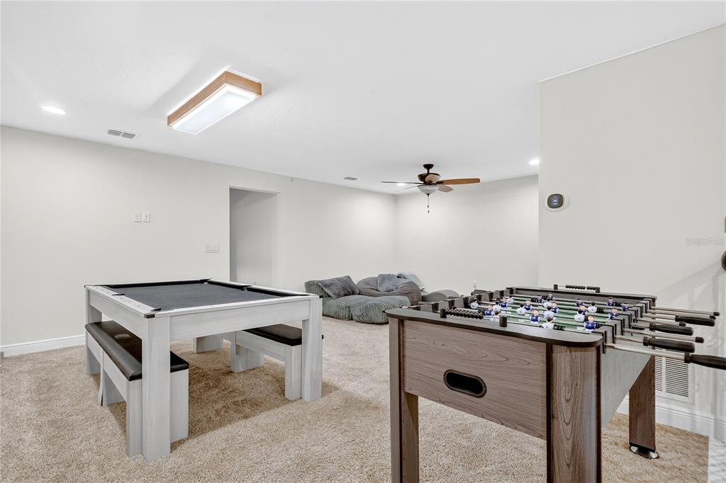 9009 Palm Key Avenue Oldsmar, FL 34677 - Photo 14 of 38 a kitchen that has a stove and a table