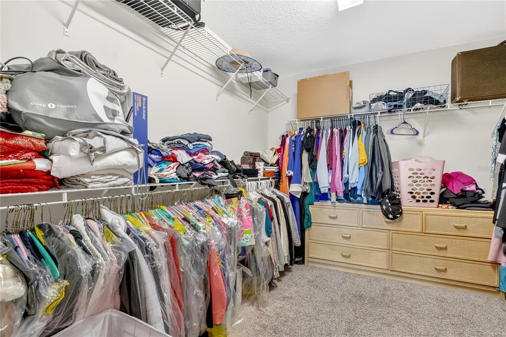 9009 Palm Key Avenue Oldsmar, FL 34677 - Photo 19 of 38 a view of walk in closet with clothes