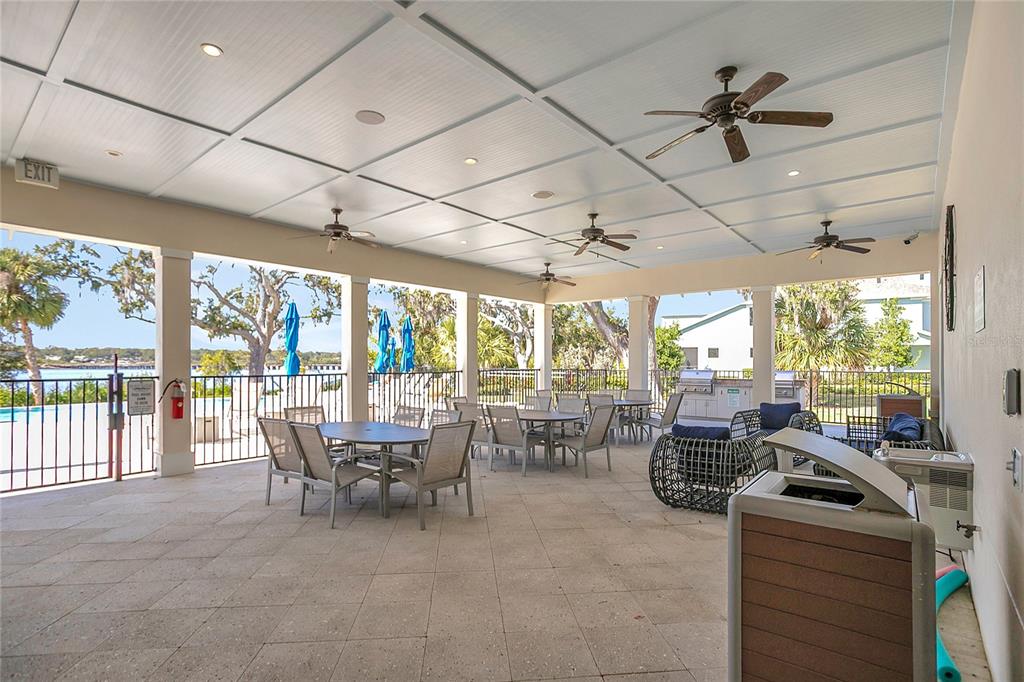 9009 Palm Key Avenue Oldsmar, FL 34677 - Photo 25 of 38 a dining room with furniture water view and a large window