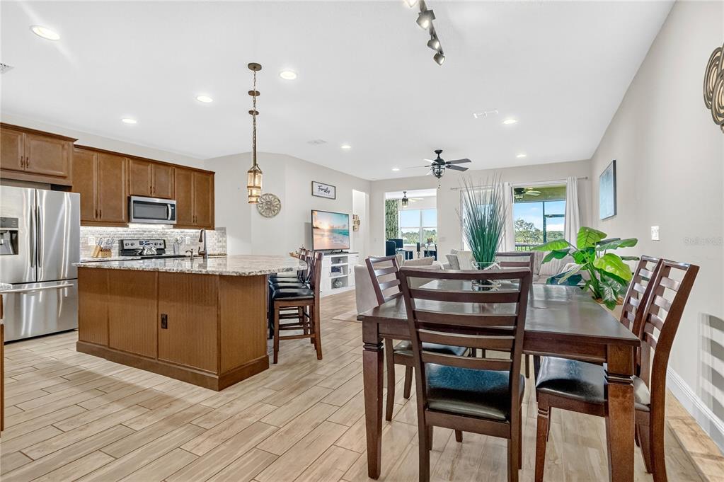 9009 Palm Key Avenue Oldsmar, FL 34677 - Photo 9 of 38 a kitchen with a table and chairs in it