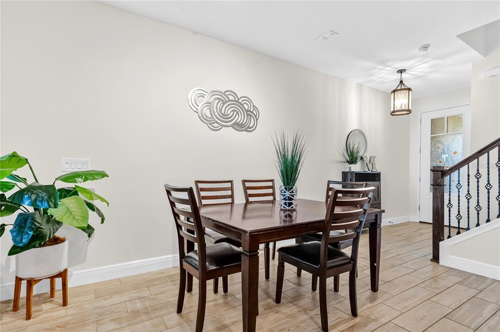 9009 Palm Key Avenue Oldsmar, FL 34677 - Photo 10 of 38 a view of a dining room with furniture