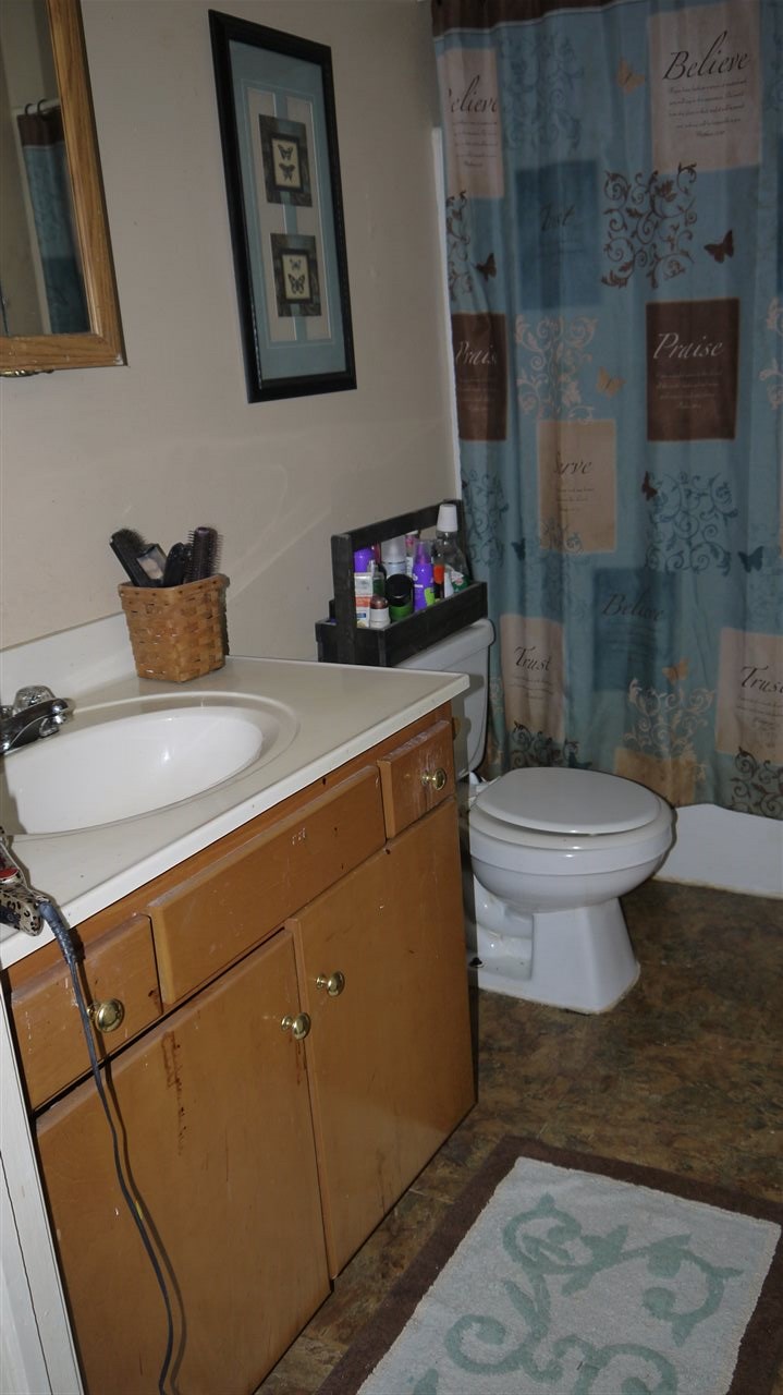 8877 Briery Branch Road Dayton, VA 22821 - Photo 7 of 12 a bathroom with a sink and a toilet