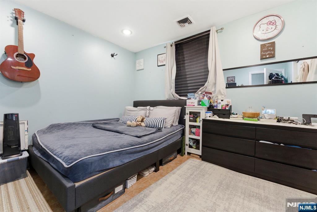 270 Westervelt Place Lodi, NJ 07644 - Photo 10 of 17 a bed room with furniture and a window