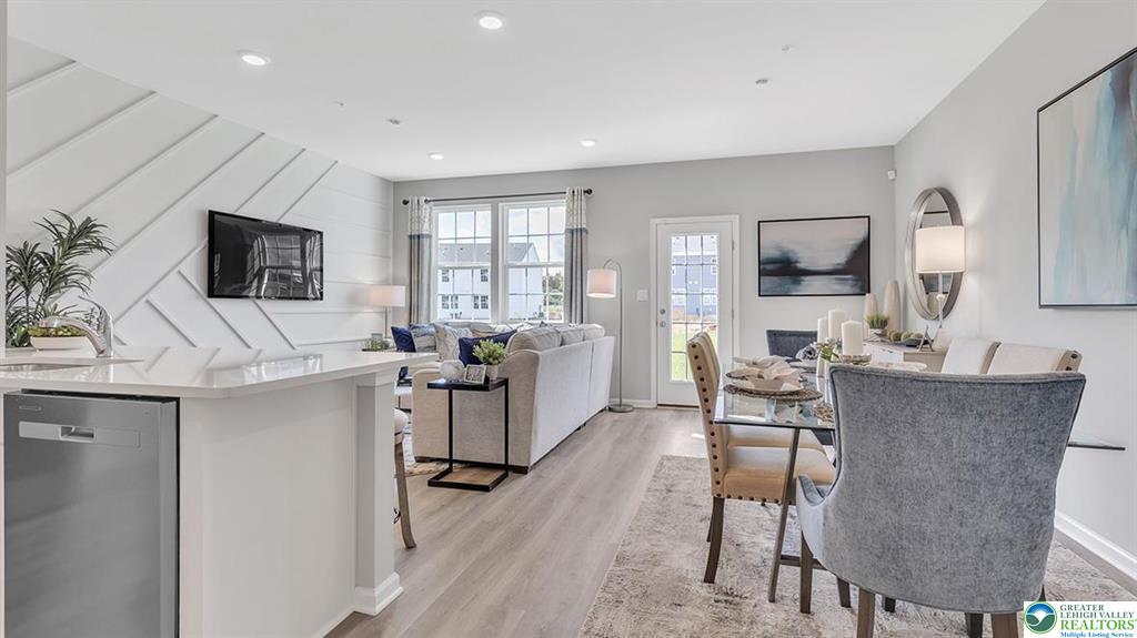1145 Martin Road Breinigsville, PA 18031 - Photo 2 of 38 An open-concept interior unites living and dining spaces, highlighted by recessed lighting and durable flooring.