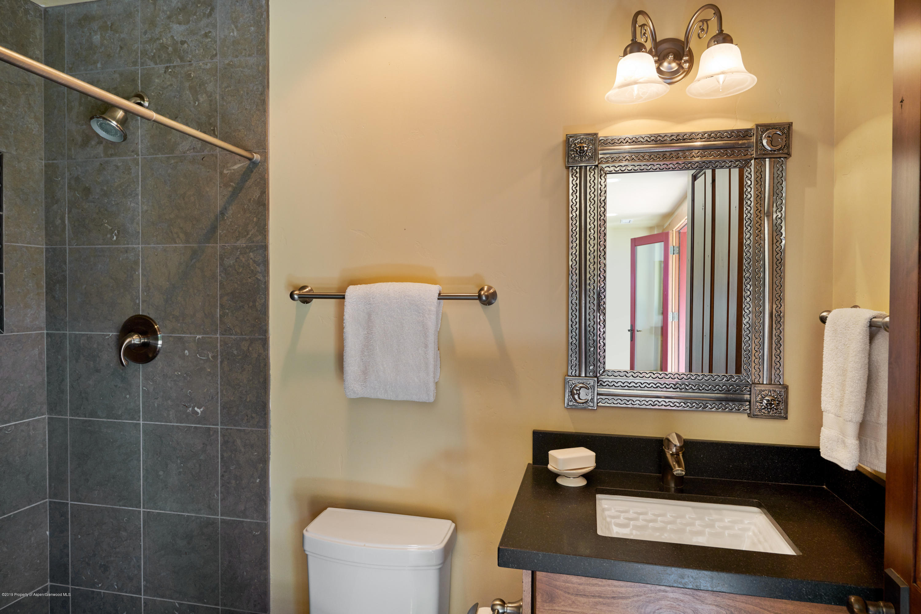 642 Holland Hills Road Basalt, CO 81621 - Photo 15 of 27 a bathroom with a sink mirror and vanity