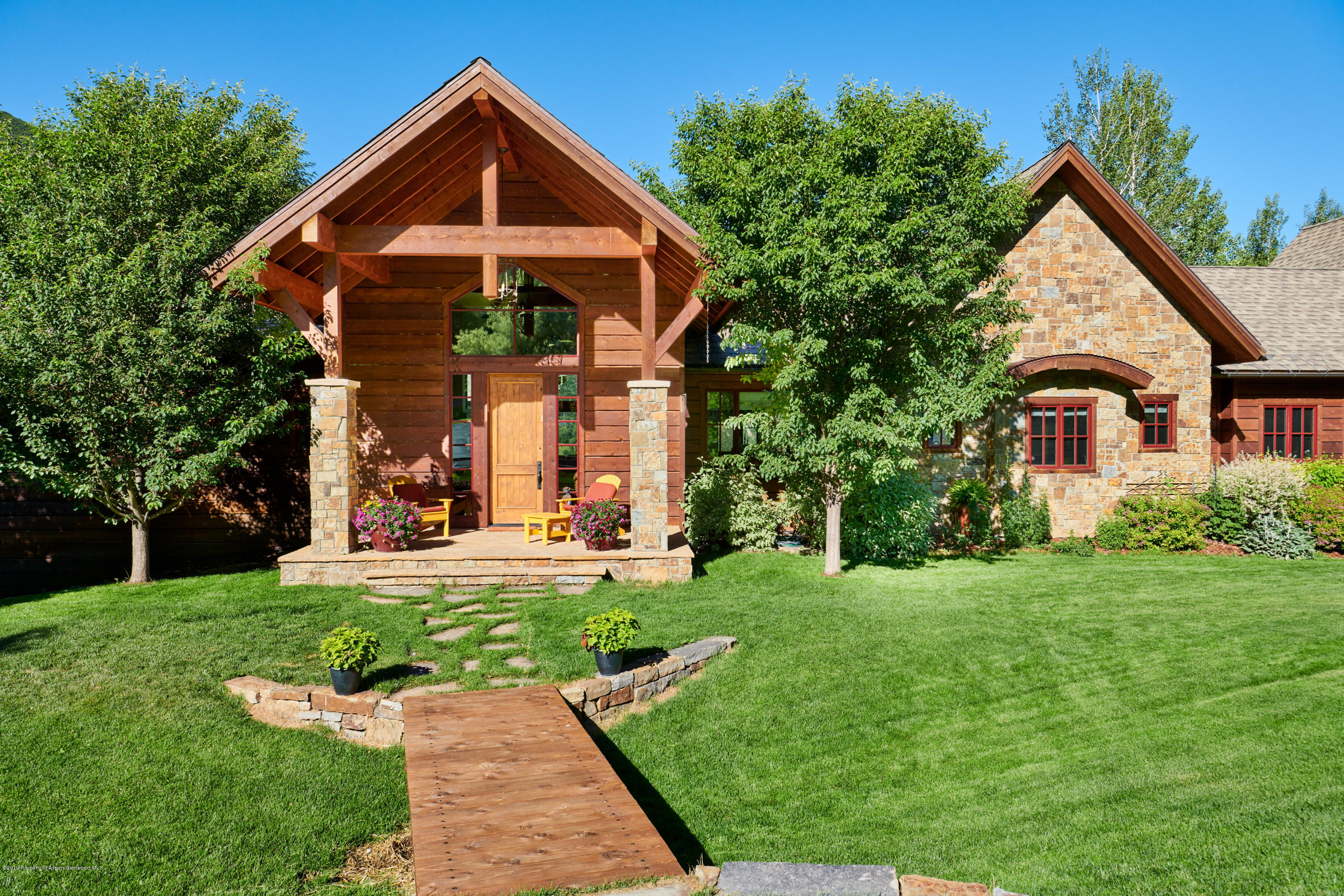 642 Holland Hills Road Basalt, CO 81621 - Photo 22 of 27 a front view of a house with a yard
