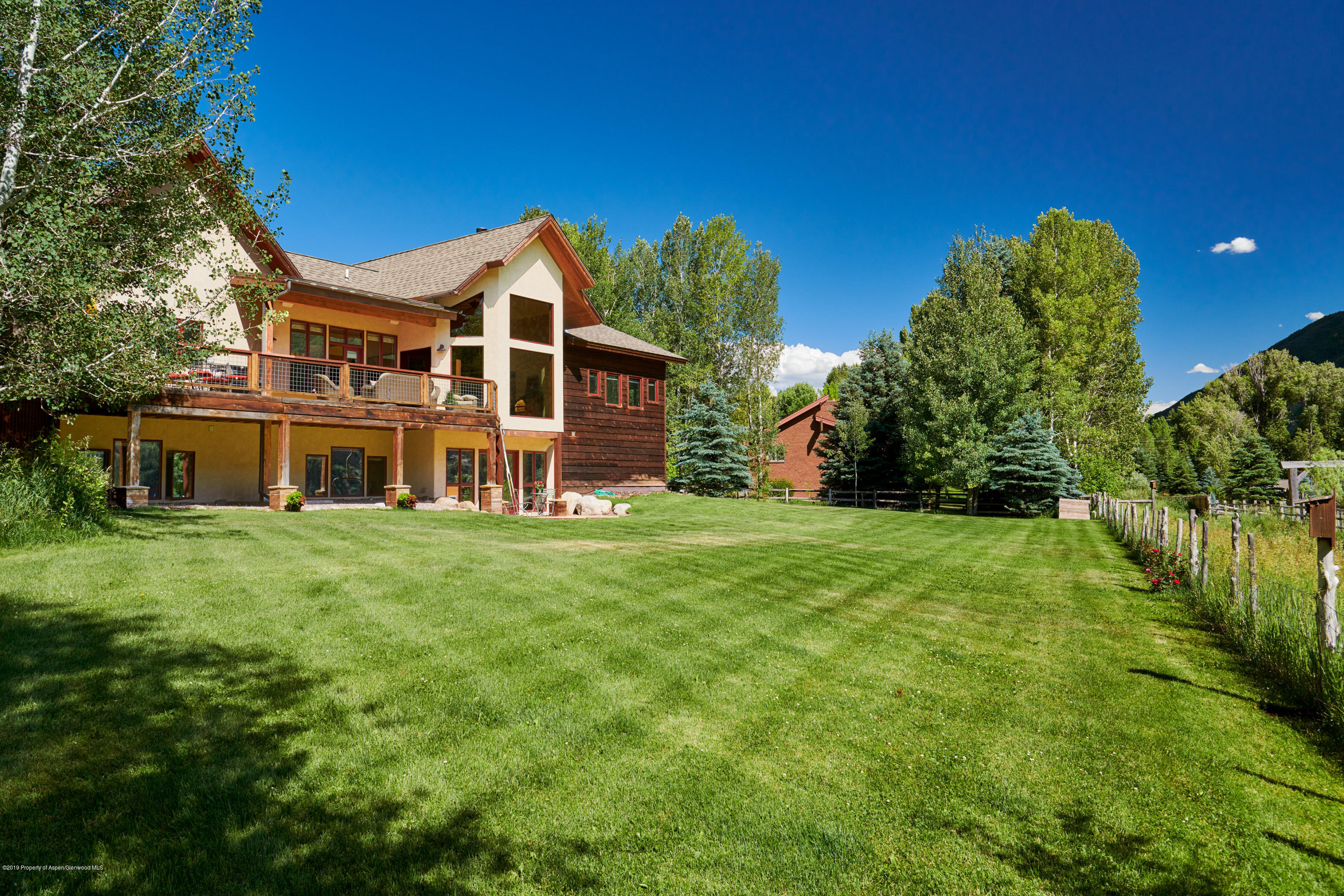 642 Holland Hills Road Basalt, CO 81621 - Photo 23 of 27 a front view of a house with a garden