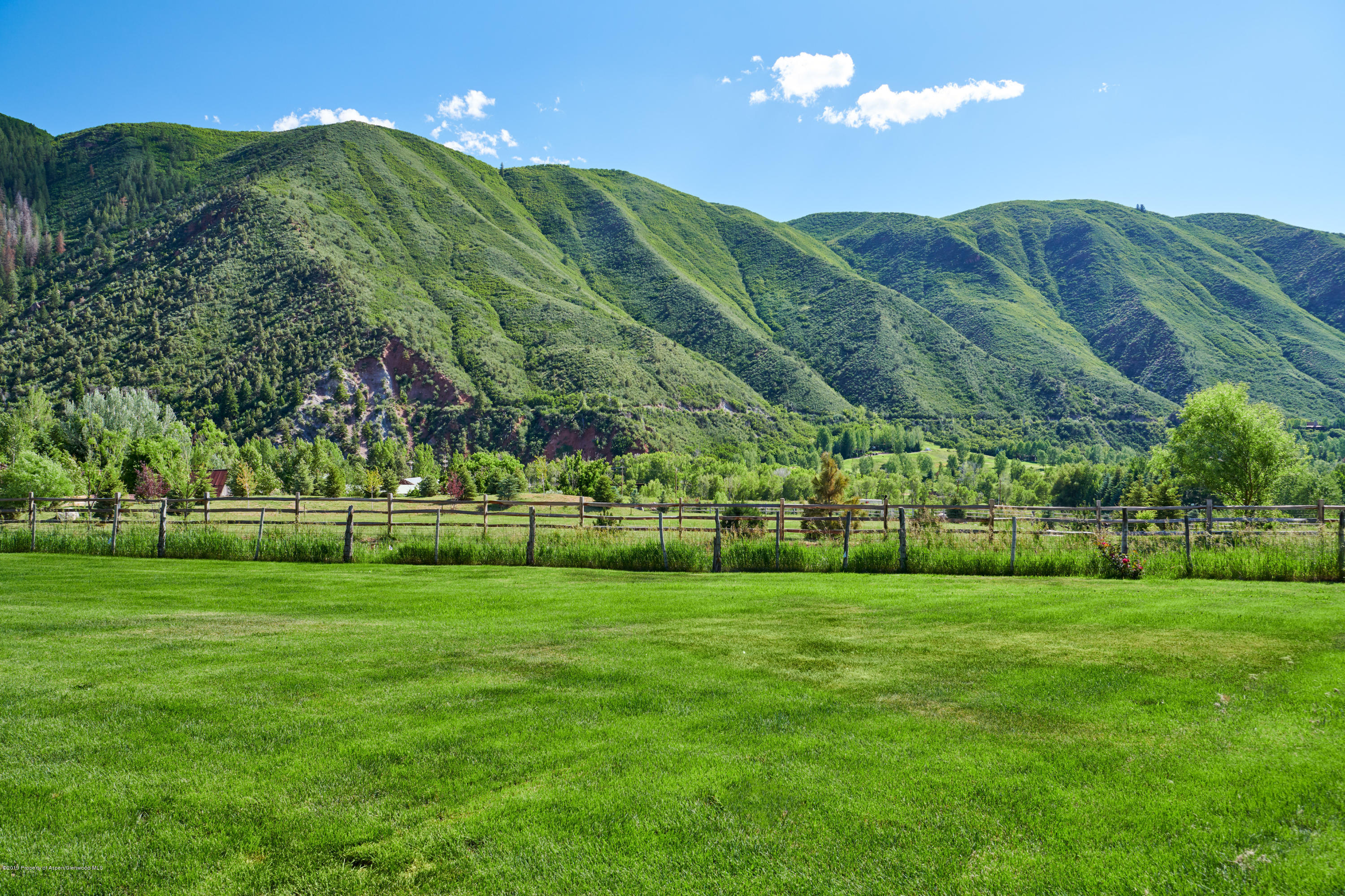 642 Holland Hills Road Basalt, CO 81621 - Photo 26 of 27 a view of a golf course with a house