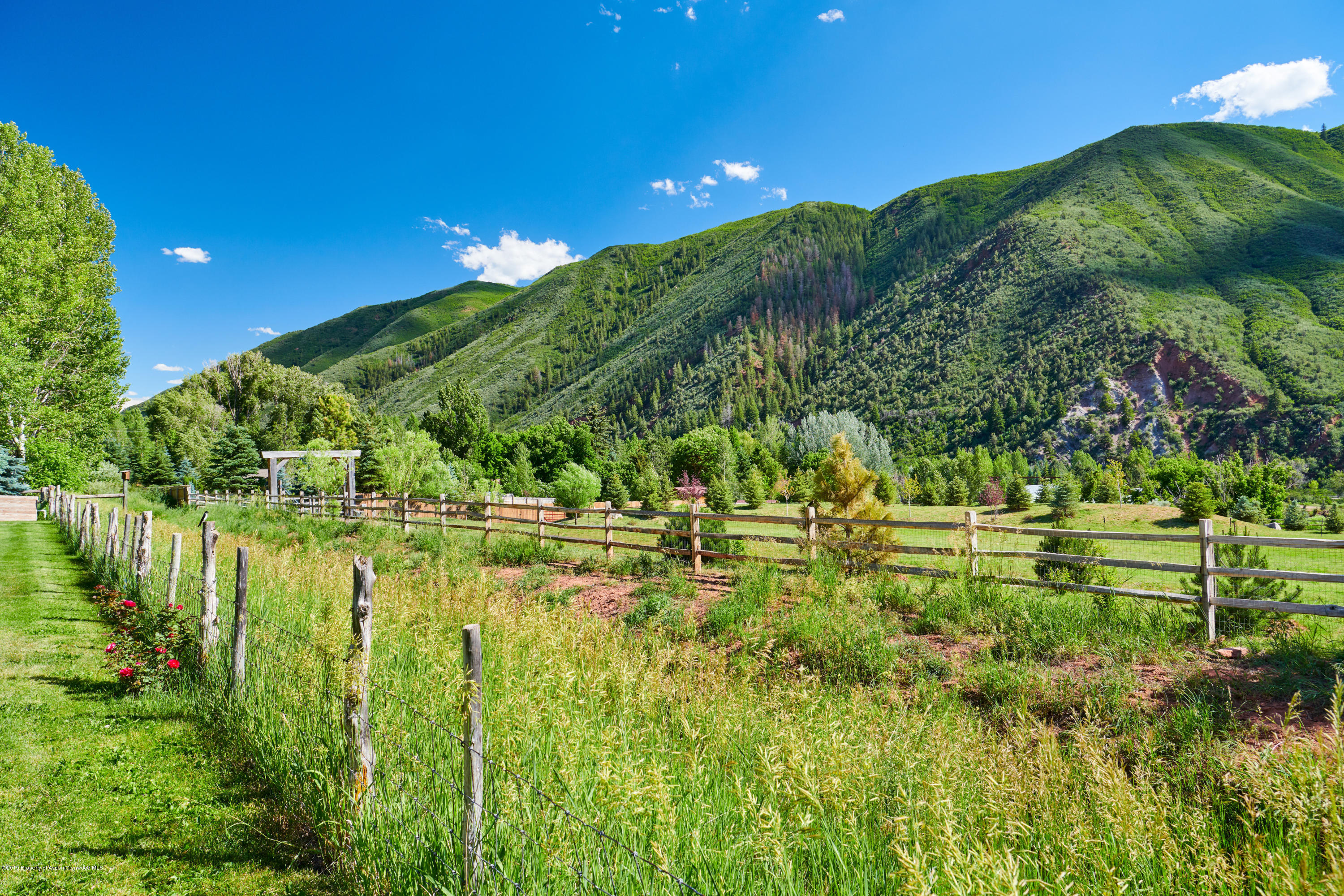 642 Holland Hills Road Basalt, CO 81621 - Photo 27 of 27 a view of a lake view with a garden