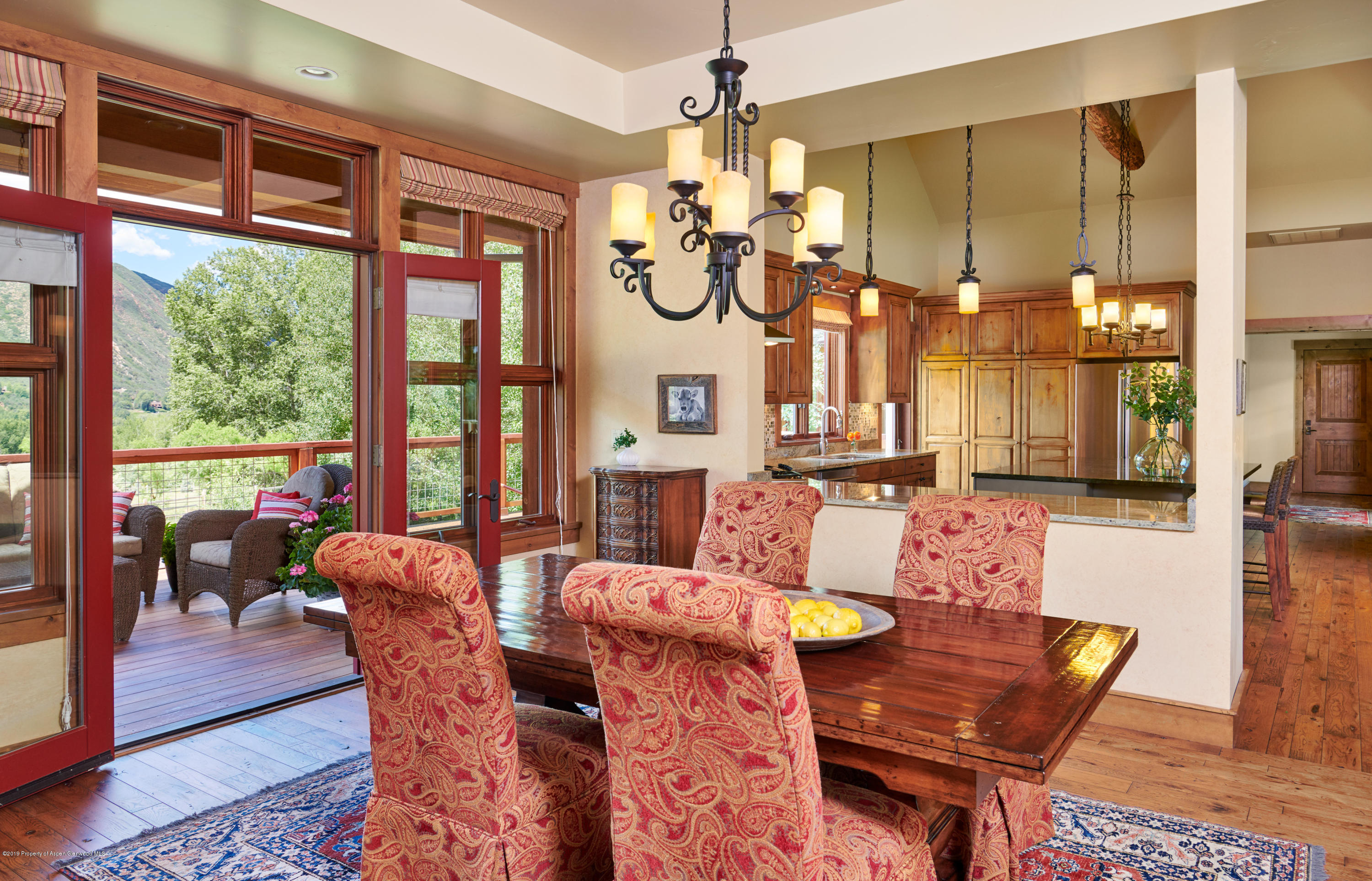 642 Holland Hills Road Basalt, CO 81621 - Photo 5 of 27 a view of a dining room with furniture window and wooden floor
