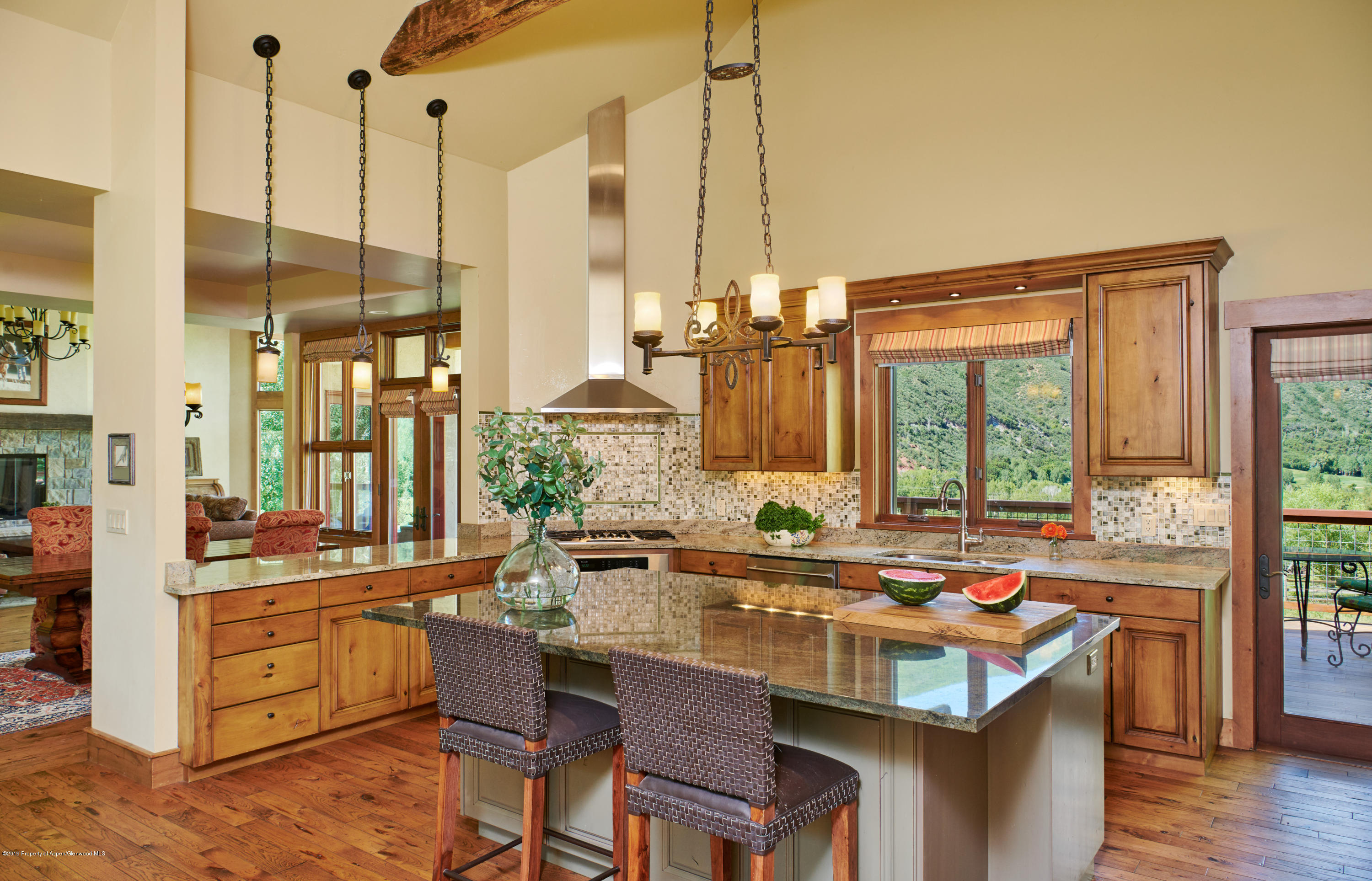 642 Holland Hills Road Basalt, CO 81621 - Photo 6 of 27 a dining table with chairs and window