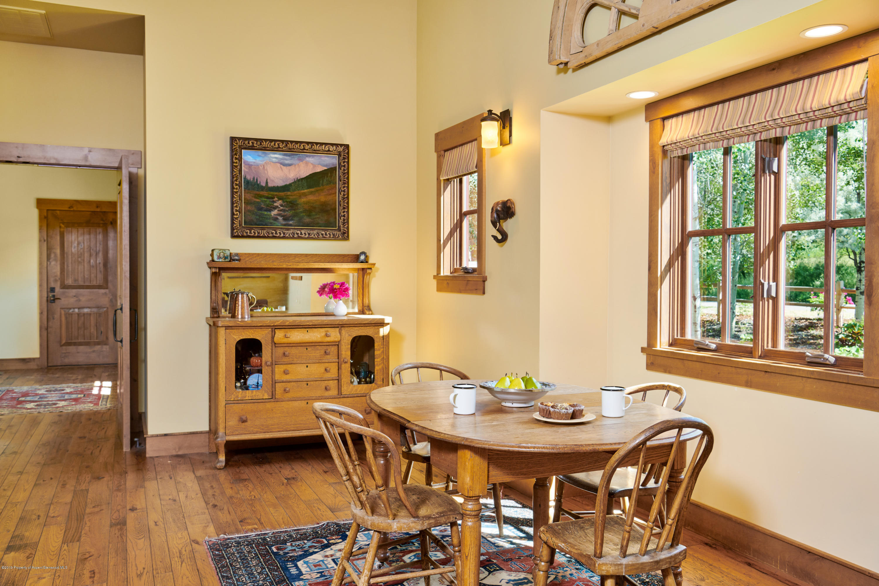 642 Holland Hills Road Basalt, CO 81621 - Photo 7 of 27 a view of a dining room with furniture window and wooden floor