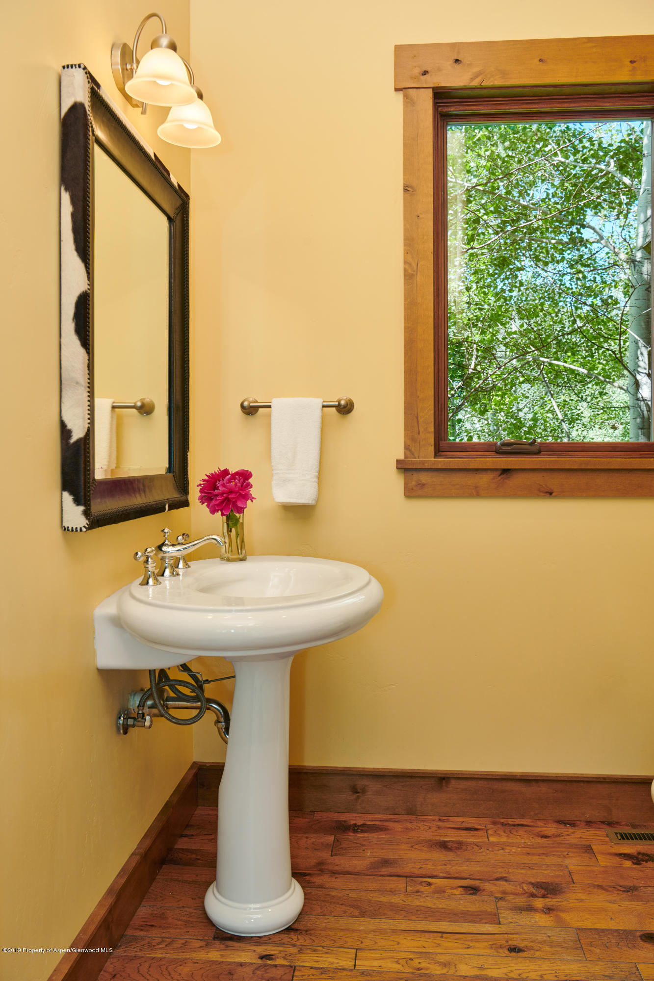 642 Holland Hills Road Basalt, CO 81621 - Photo 9 of 27 a bathroom with a sink and a mirror