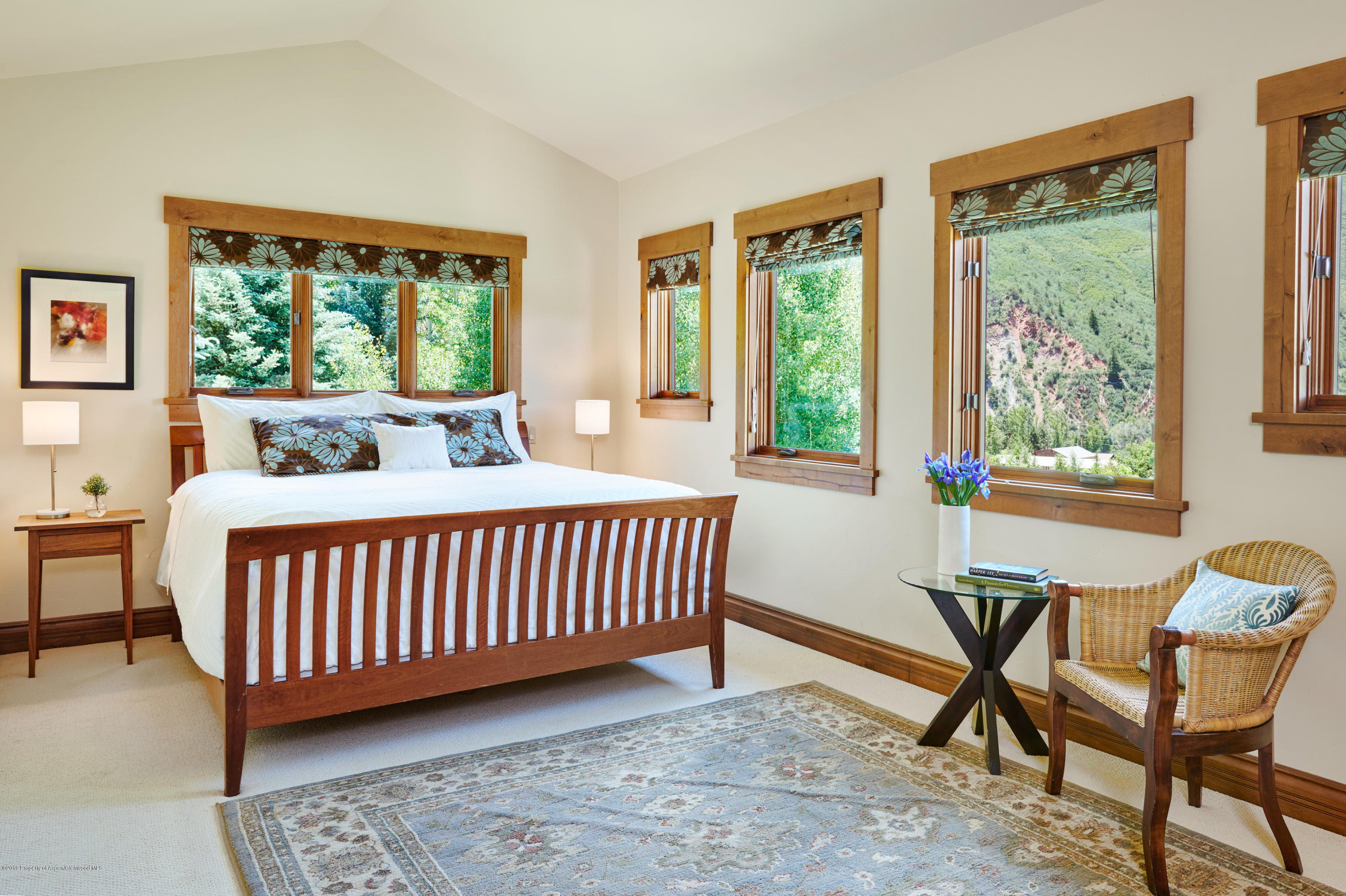 642 Holland Hills Road Basalt, CO 81621 - Photo 10 of 27 a bedroom with furniture and a window