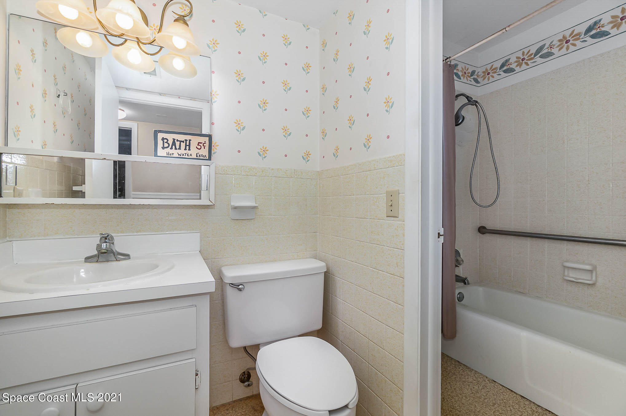 416 School Road, Unit 102 Indian Harbour Beach, FL 32937 - Photo 11 of 27 a bathroom with a sink a toilet and shower