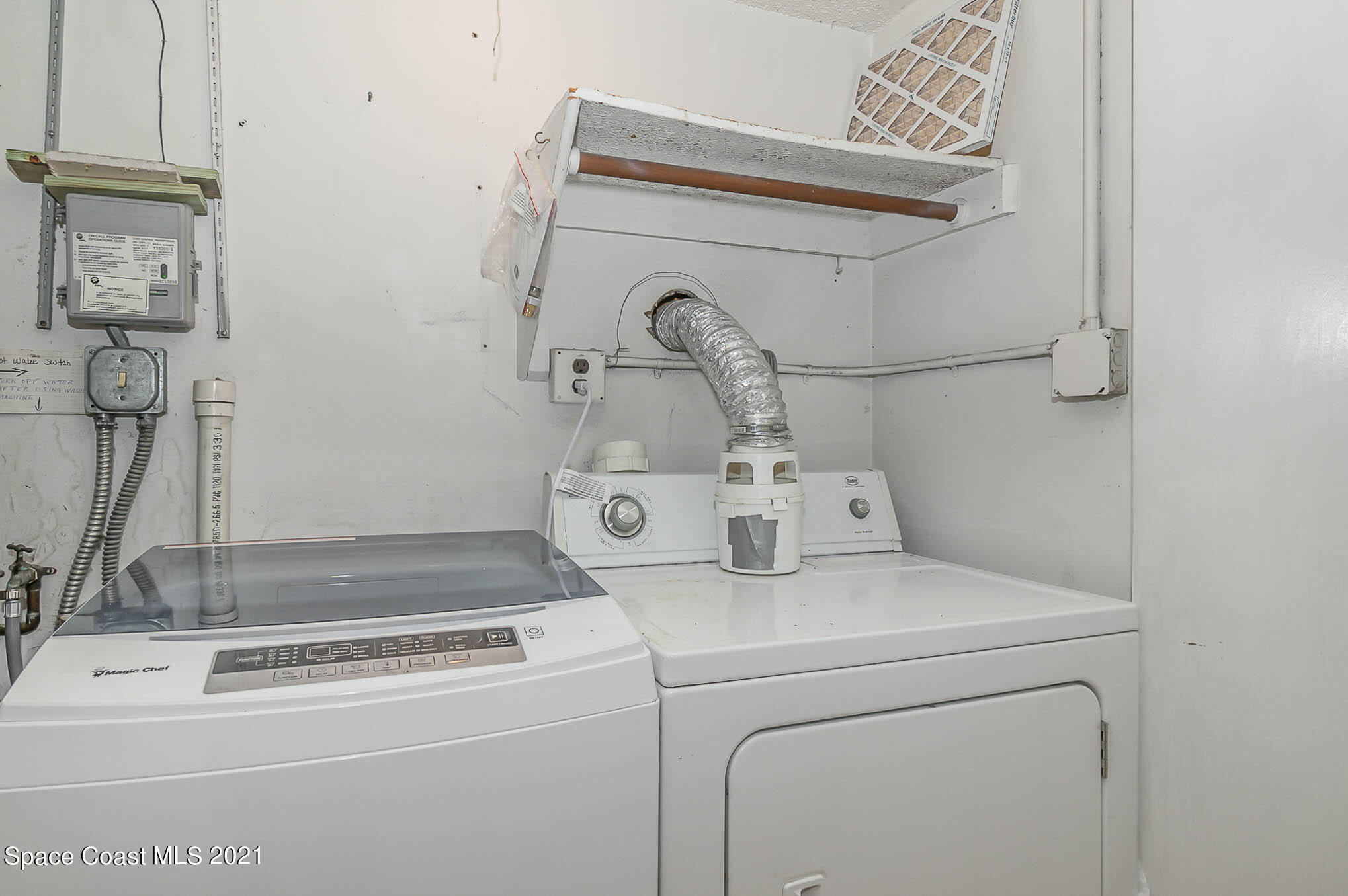 416 School Road, Unit 102 Indian Harbour Beach, FL 32937 - Photo 12 of 27 a utility room with dryer and washer