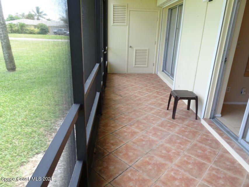 416 School Road, Unit 102 Indian Harbour Beach, FL 32937 - Photo 14 of 27 a view of balcony with furniture
