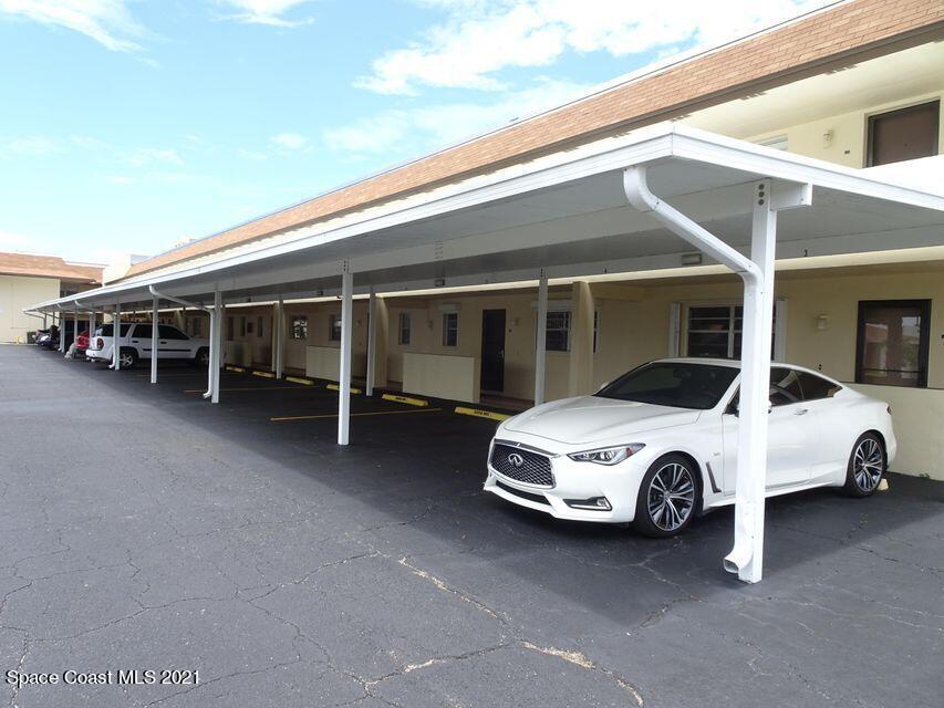 416 School Road, Unit 102 Indian Harbour Beach, FL 32937 - Photo 15 of 27 a car parked in garage