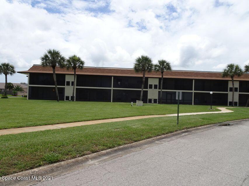 416 School Road, Unit 102 Indian Harbour Beach, FL 32937 - Photo 17 of 27 a view of a house with a backyard