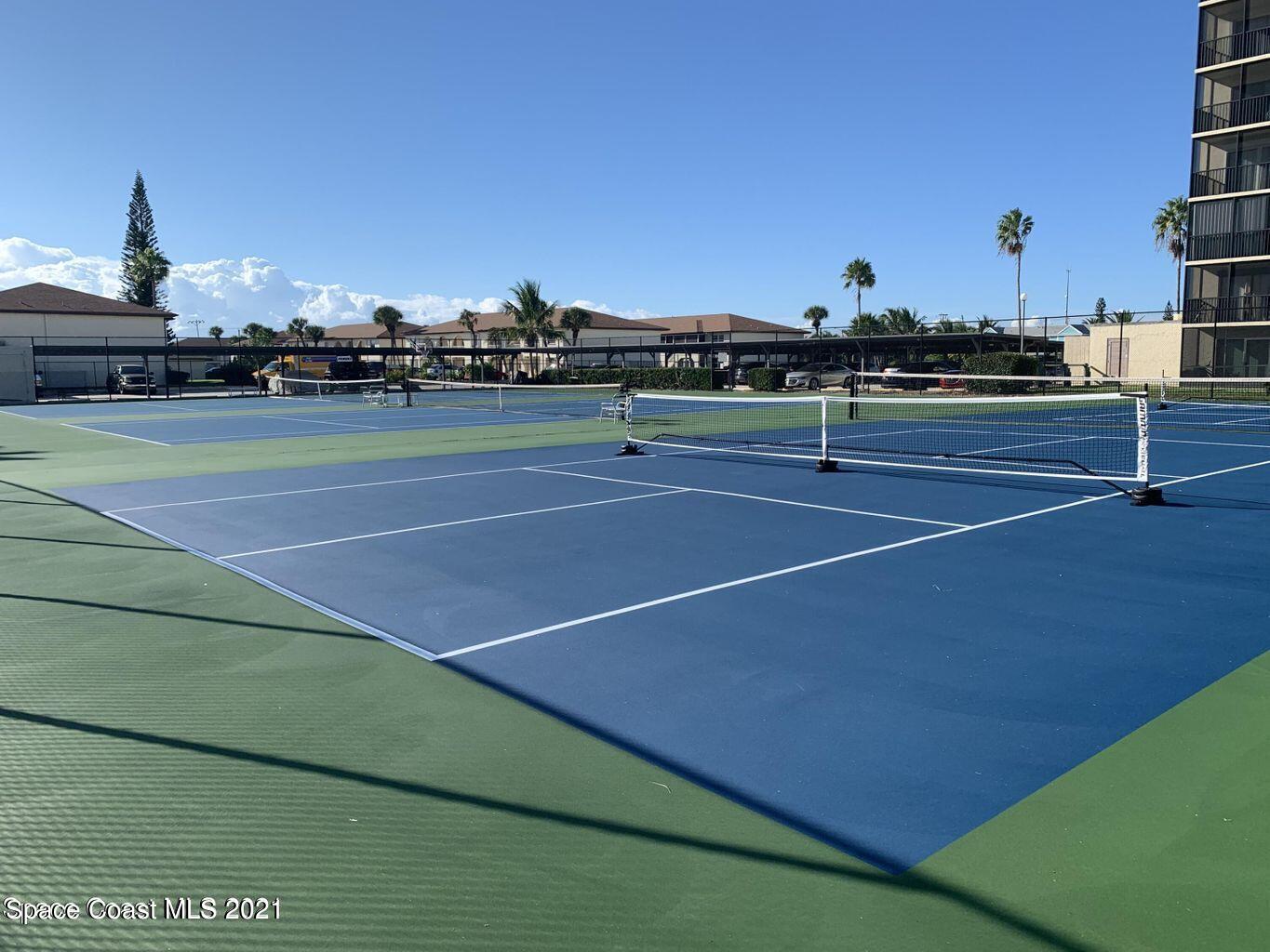 416 School Road, Unit 102 Indian Harbour Beach, FL 32937 - Photo 25 of 27 a view of an outdoor space and tennis court