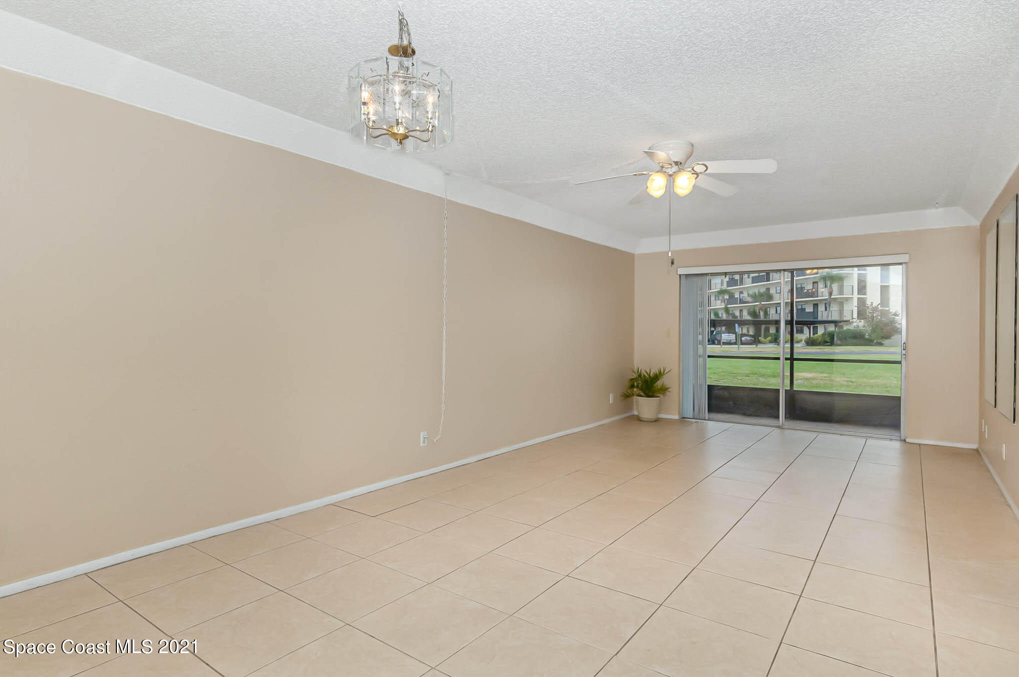 416 School Road, Unit 102 Indian Harbour Beach, FL 32937 - Photo 3 of 27 a view of an empty room with a window