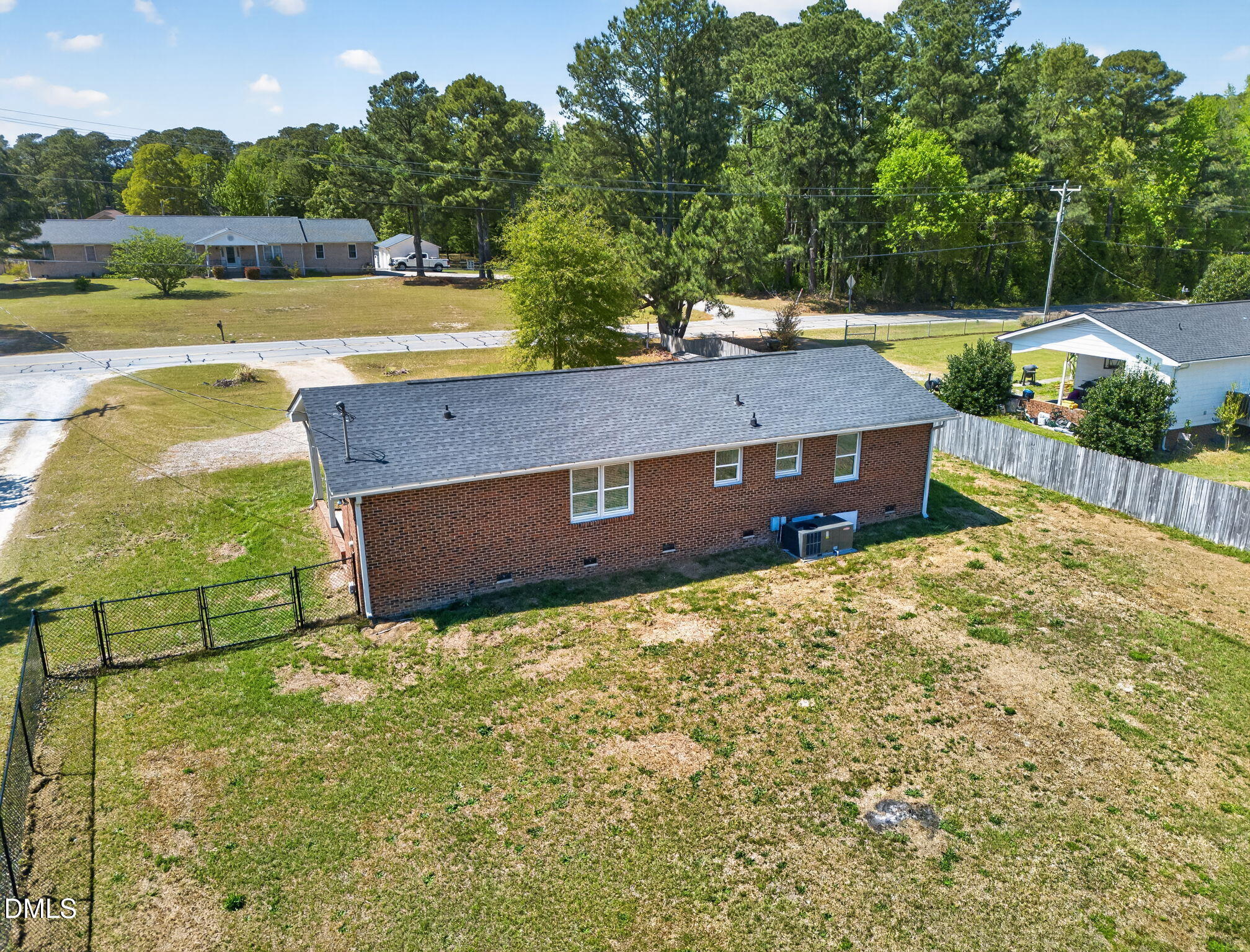 6086 Red Hill Church Road Coats, NC 27521 - Photo 31 of 44 a view of a house with a yard