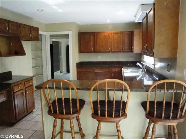 6017 Country Walk Road Midlothian, VA 23112 - Photo 2 of 12 Kitchen - New granite, a snack bar and a HUGE eat in kitchen area - all this and 2 pantries!