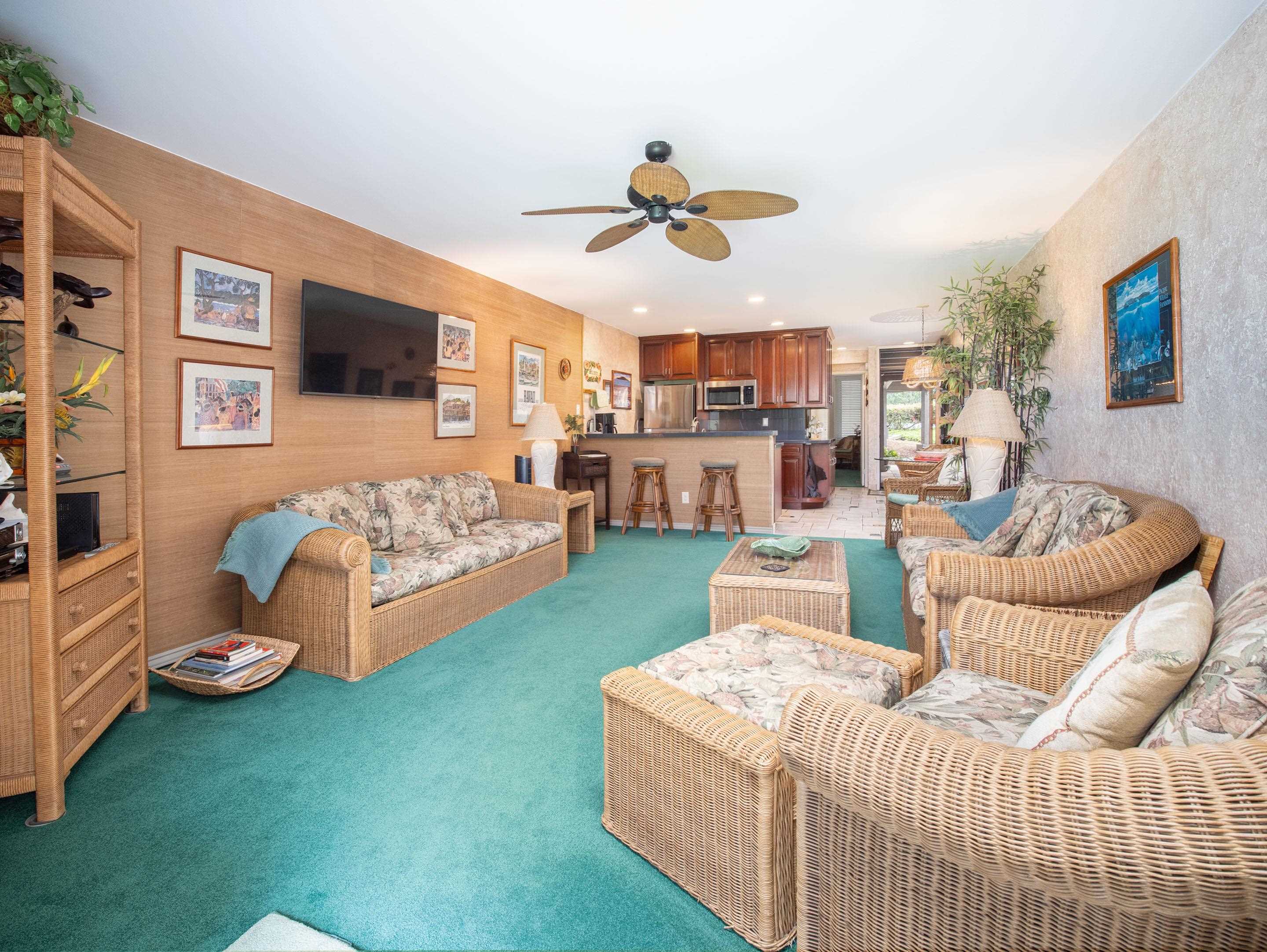 2737 South Kihei Road, Unit 1119 Kihei, HI 96753 - Photo 2 of 24 a living room with furniture and a flat screen tv