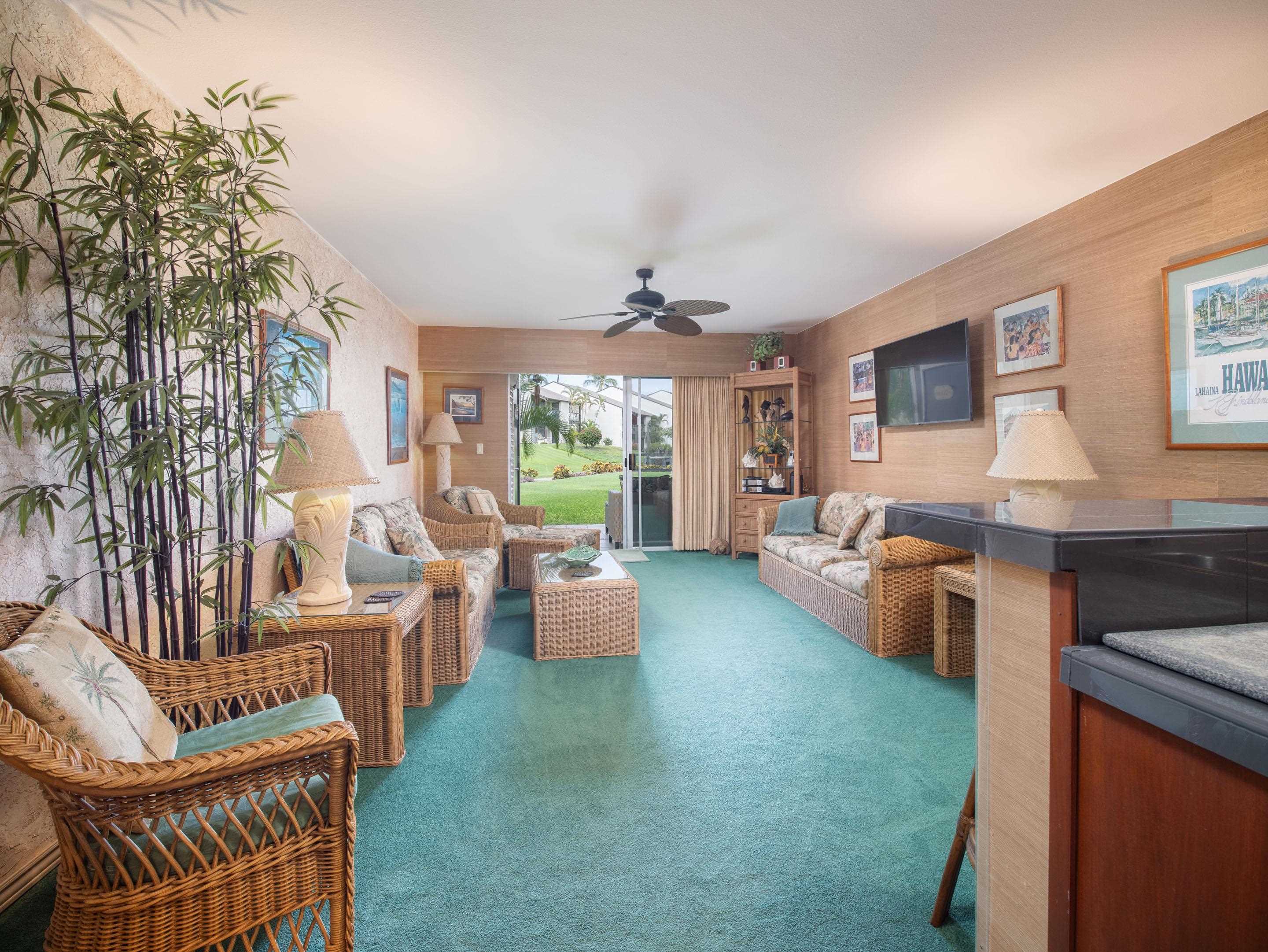2737 South Kihei Road, Unit 1119 Kihei, HI 96753 - Photo 3 of 24 a living room with furniture and a large window